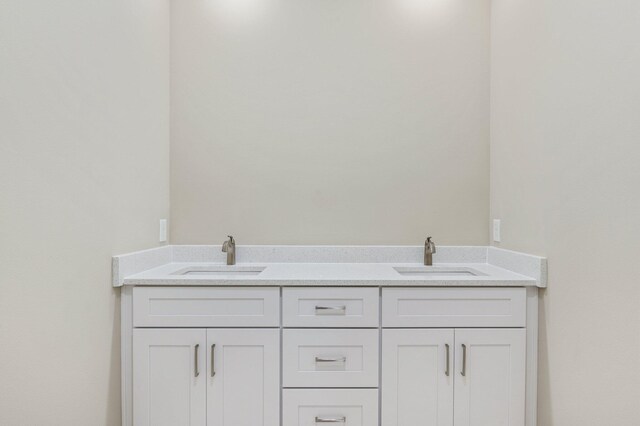 bathroom featuring dual vanity