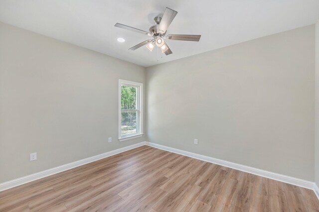 empty room featuring light hardwood / wood-style flooring and ceiling fan