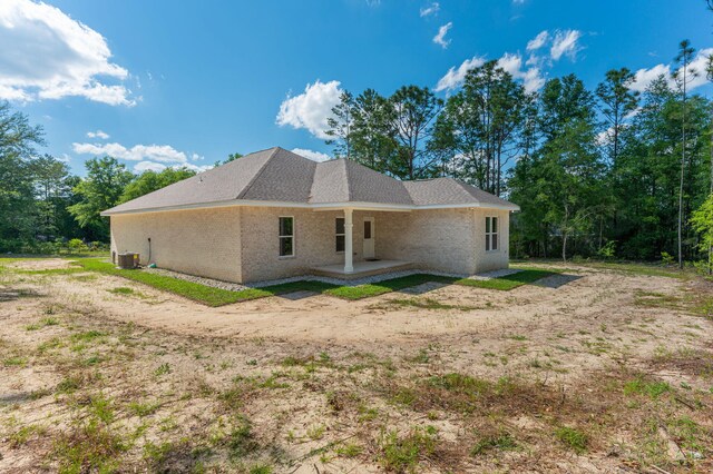 back of house with a patio and central AC