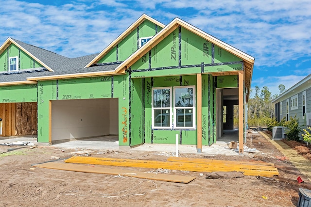 unfinished property featuring a garage