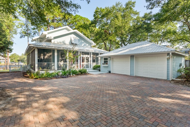 view of front facade with a sunroom