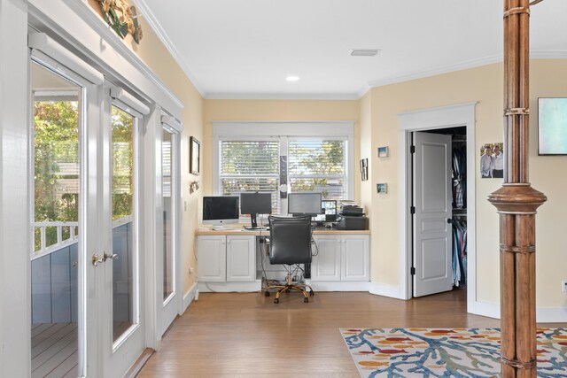 office space with wood-type flooring, ornamental molding, and french doors