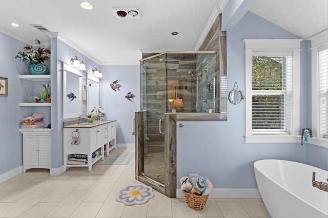 bathroom featuring crown molding, visible vents, a freestanding bath, a shower stall, and vanity