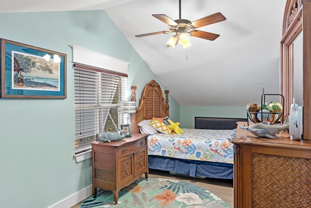 bedroom with ceiling fan and vaulted ceiling