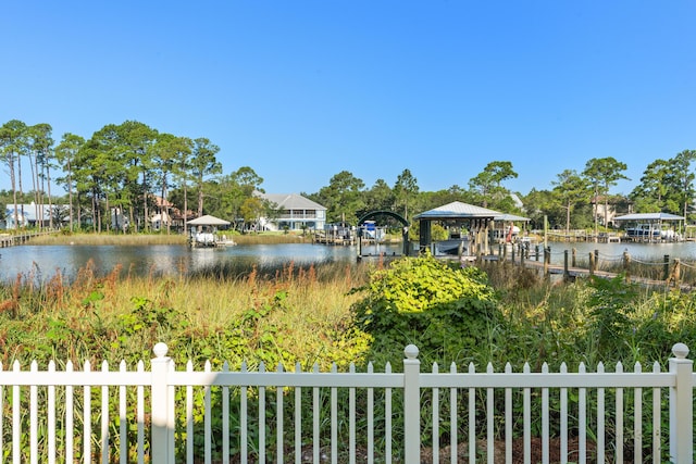 water view featuring fence and a gazebo