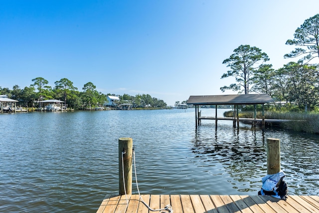 view of dock featuring a water view and boat lift