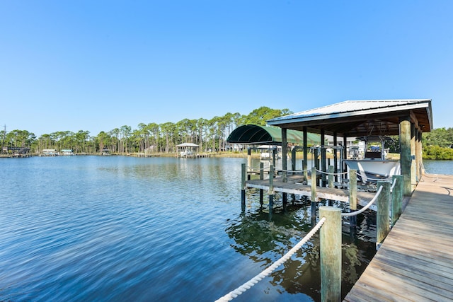 dock area featuring a water view and boat lift