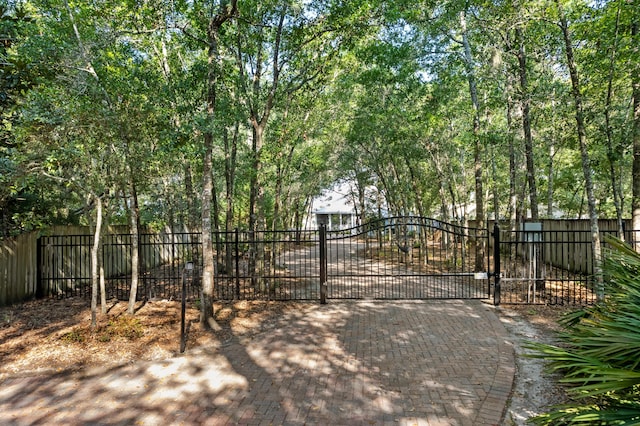 view of gate with fence