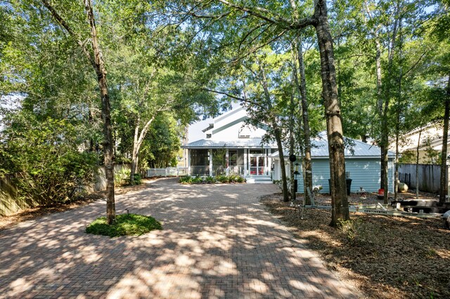 view of front of house featuring a sunroom