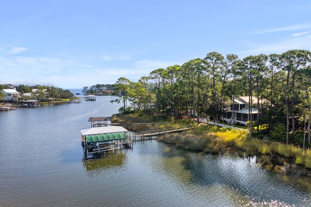 dock area with a water view and boat lift