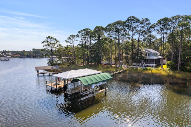 dock area with a water view and boat lift