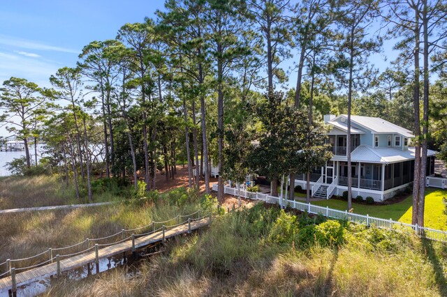 exterior space featuring a sunroom