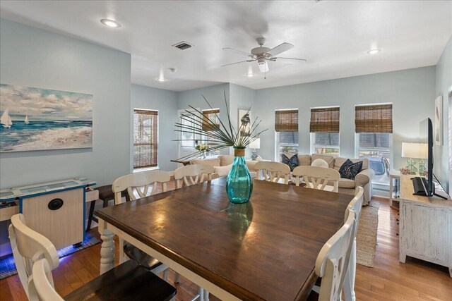 dining room featuring ceiling fan and light wood-type flooring