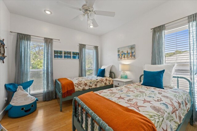 bedroom featuring ceiling fan and light wood-type flooring