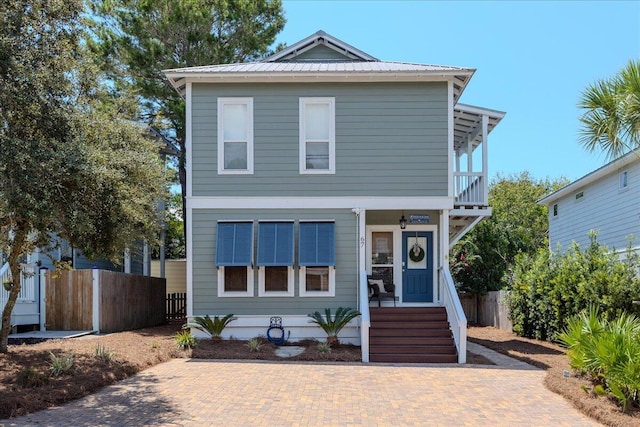 view of front of house with a balcony