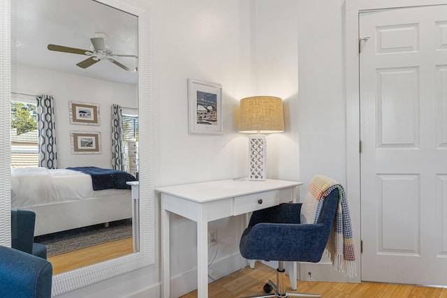 office featuring light wood-type flooring and ceiling fan