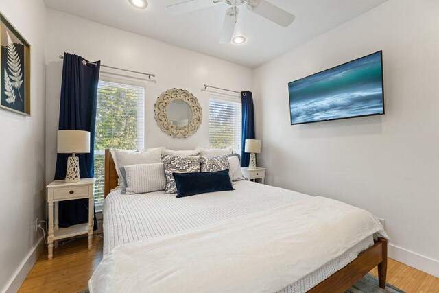 bedroom featuring ceiling fan and hardwood / wood-style floors