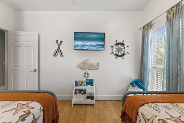 bedroom with light hardwood / wood-style flooring