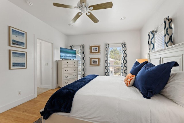 bedroom featuring light hardwood / wood-style flooring and ceiling fan