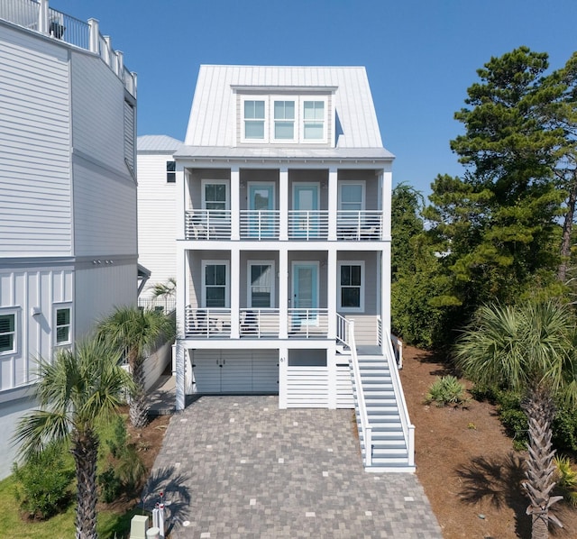 beach home featuring a balcony