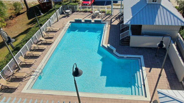 view of swimming pool featuring a patio area