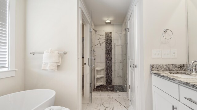 bathroom with tile patterned flooring, independent shower and bath, and vanity