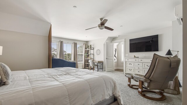 carpeted bedroom featuring ceiling fan and a wall unit AC