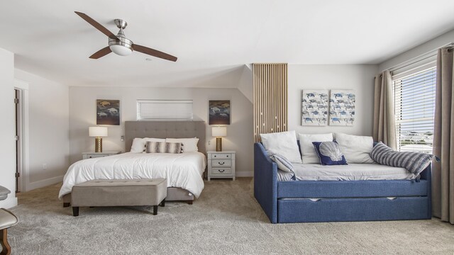 bedroom with ceiling fan and light carpet