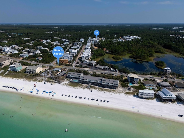 drone / aerial view with a water view and a view of the beach