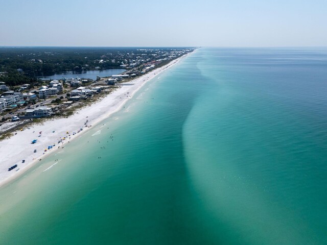 bird's eye view with a beach view and a water view