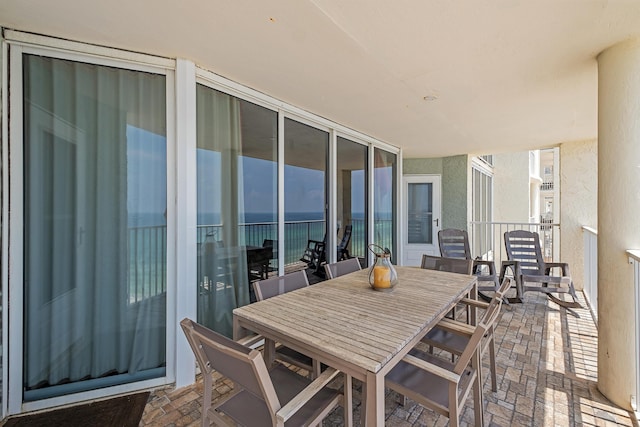 view of patio / terrace with outdoor dining space and a balcony