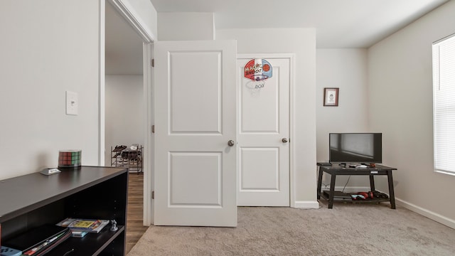 interior space featuring light carpet