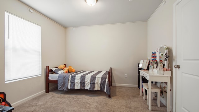 bedroom featuring light carpet and ornamental molding