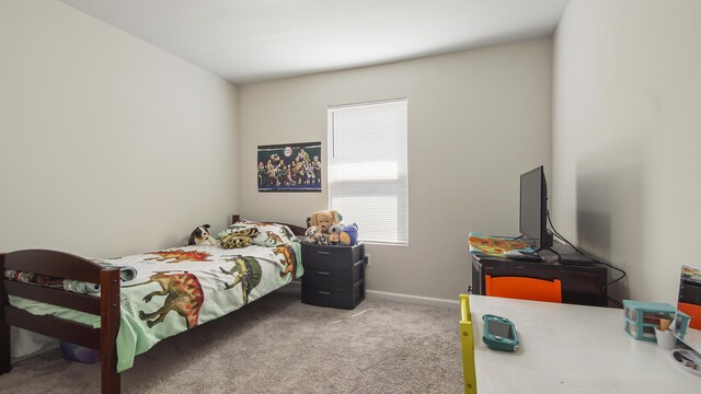 bedroom featuring light colored carpet