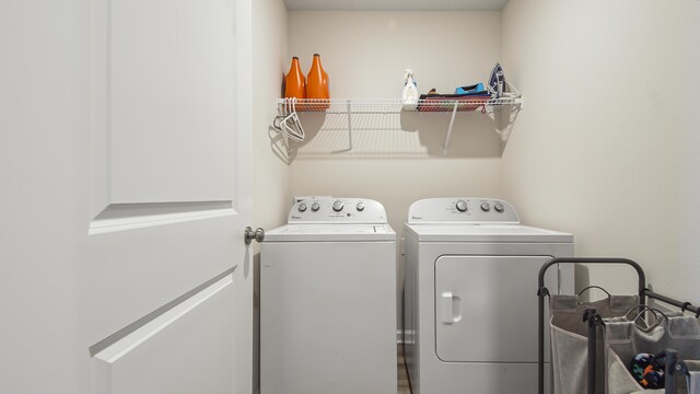 laundry area with washing machine and clothes dryer