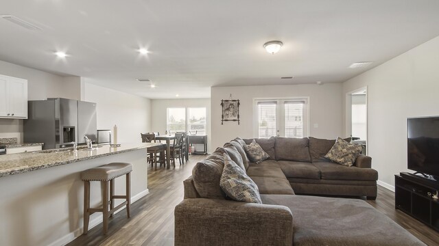 living room featuring dark hardwood / wood-style floors