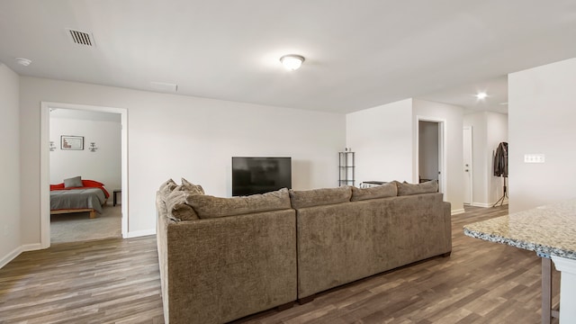 living room featuring dark hardwood / wood-style floors