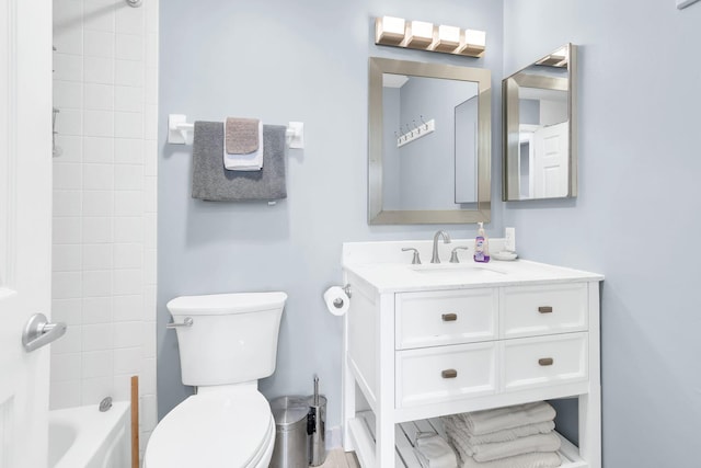 full bathroom with tiled shower / bath combo, vanity, and toilet