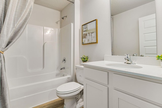 full bathroom with toilet, vanity, wood-type flooring, a textured ceiling, and shower / bath combo with shower curtain