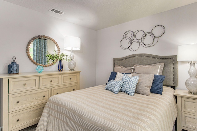 bedroom featuring a textured ceiling