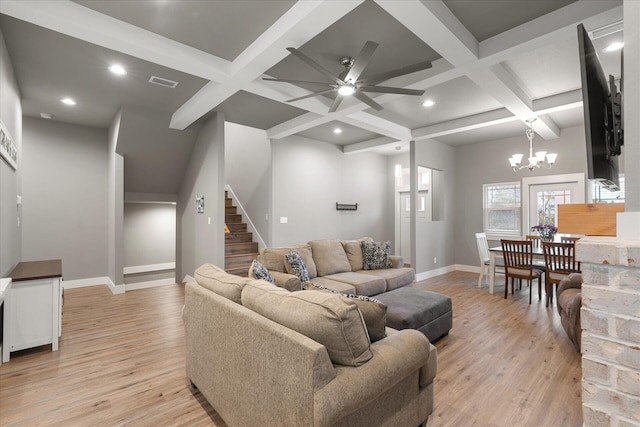 living room featuring coffered ceiling, light wood-style flooring, and baseboards