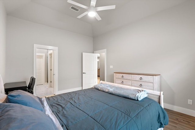 bedroom with ceiling fan, high vaulted ceiling, and light hardwood / wood-style floors