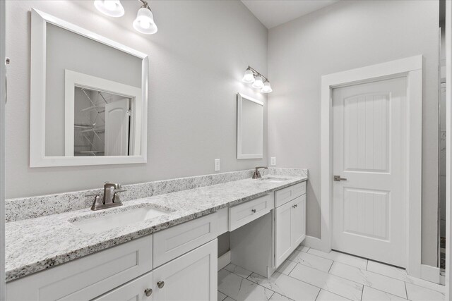 bathroom with tile patterned flooring and vanity