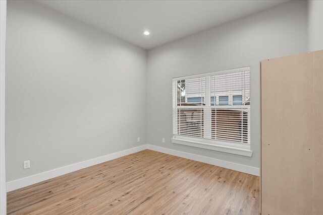 spare room with light hardwood / wood-style floors