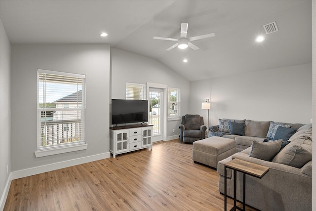 living room with vaulted ceiling, light hardwood / wood-style flooring, and ceiling fan