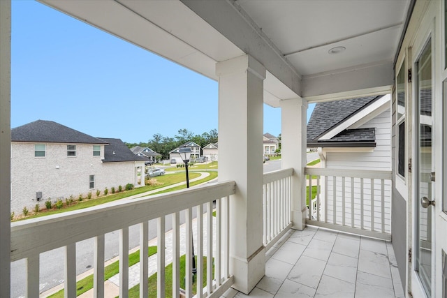 balcony featuring a residential view