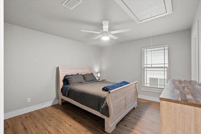 bedroom with wood-type flooring and ceiling fan