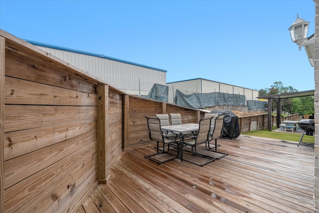 deck featuring outdoor dining area