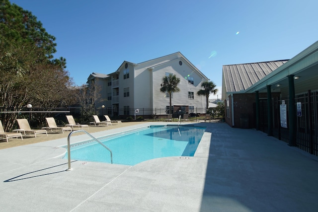 view of swimming pool featuring a patio