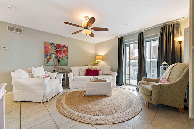 tiled living room featuring ceiling fan